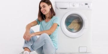 Woman listening to music and doing laundry